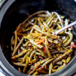 Overhead shot of cooked green beans in a slow cooker.