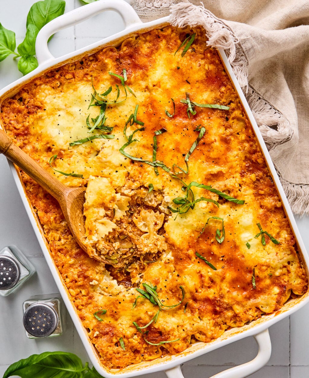 A large casserole dish filled with cheesy ground beef and zucchini.