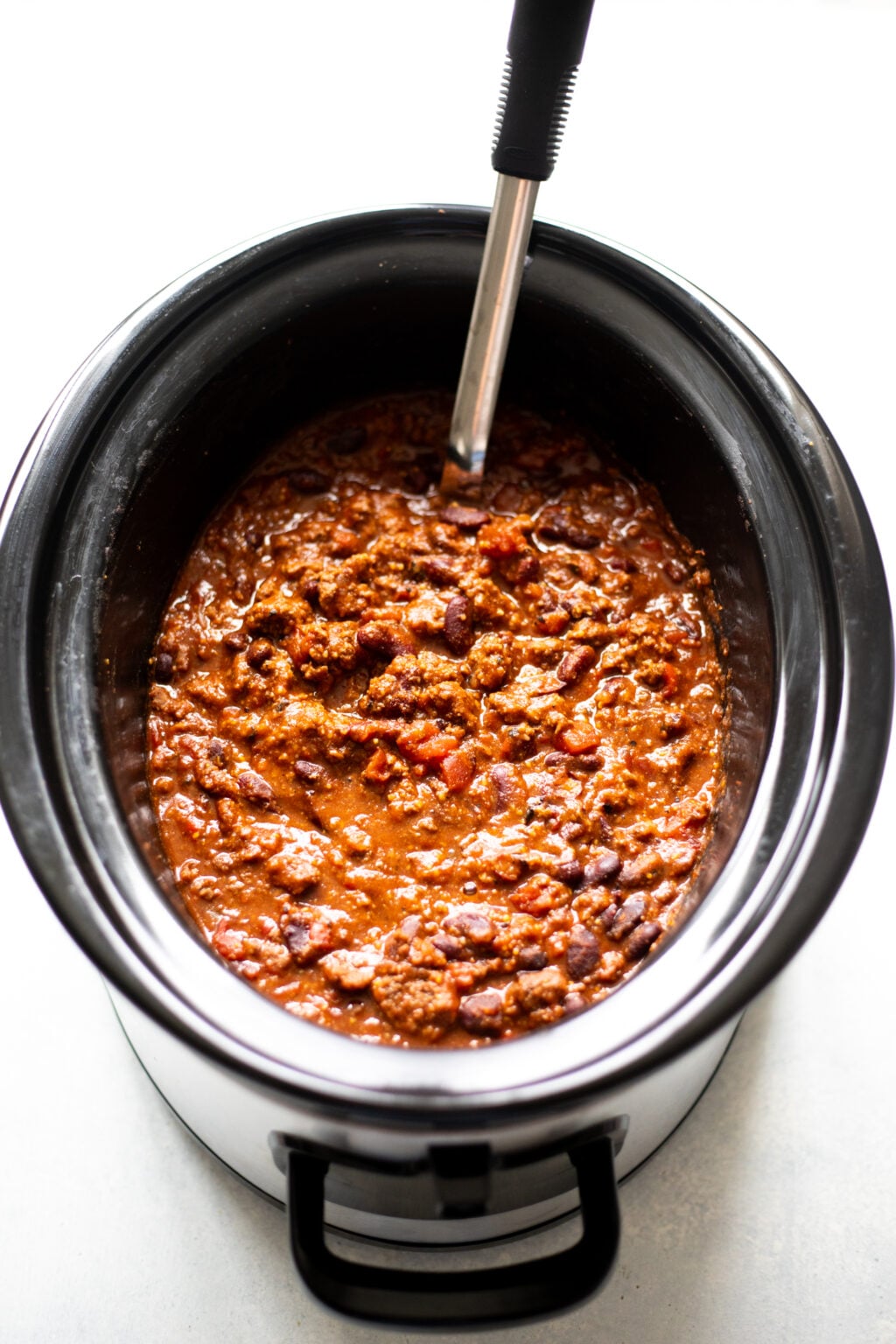 Slow cooker filled with beef chili.