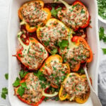 A large casserole dish with stuffed peppers.