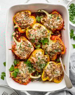 A large casserole dish with stuffed peppers.