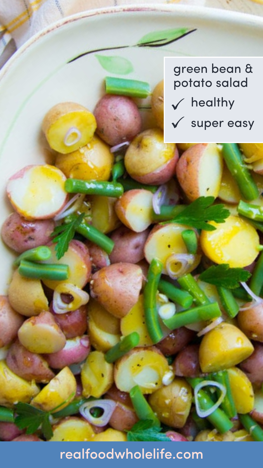 A plate of cooked and sliced red potatoes and green beans with the text "green bean & potato salad."