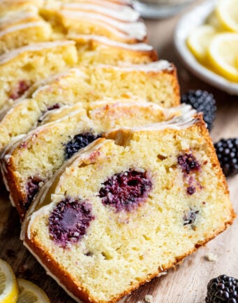 Slices of lemon blackberry cake leaning against each other.