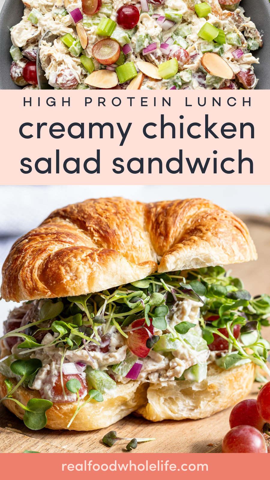 A croissant sandwich filled with creamy chicken salad, red grapes, celery, almonds, and microgreens, with a bowl of the chicken salad visible in the background.