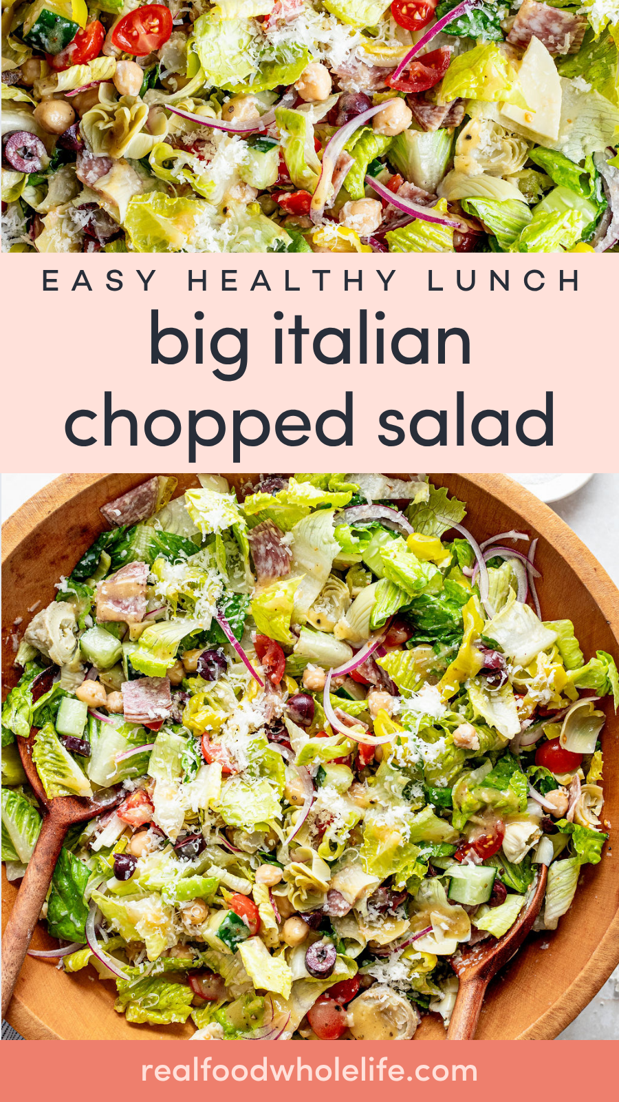 A large wooden bowl filled with Italian chopped salad made of lettuce, tomatoes, olives, onions, chickpeas, cheese, and herbs, with salad servers placed on the sides.