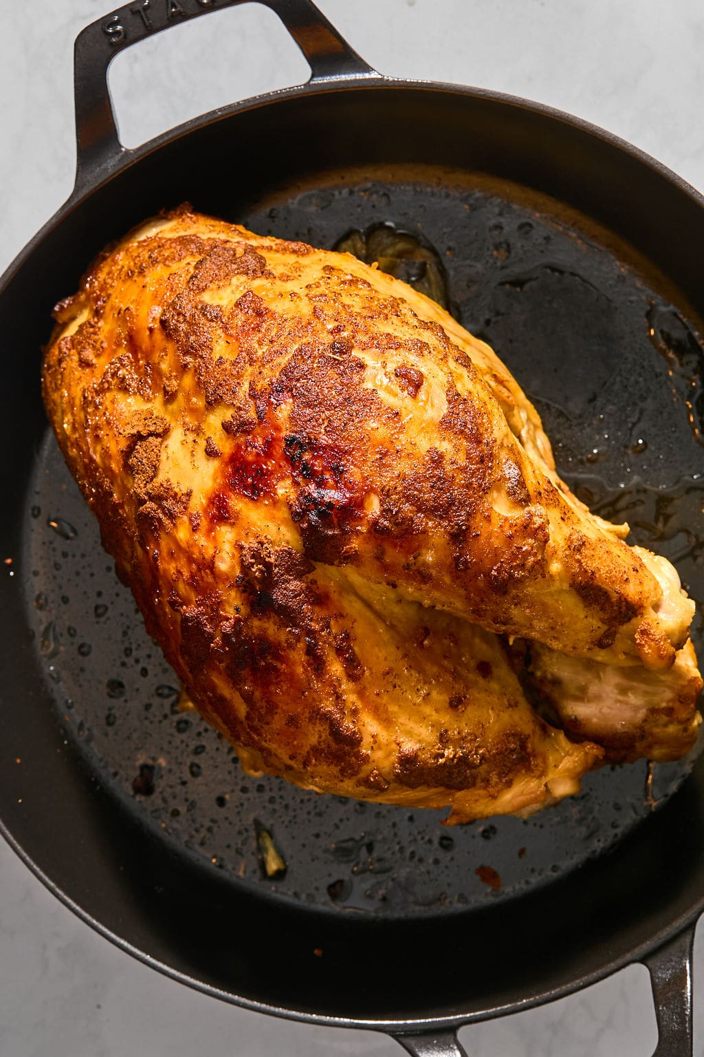 Roasted turkey breast in a cast-iron skillet.